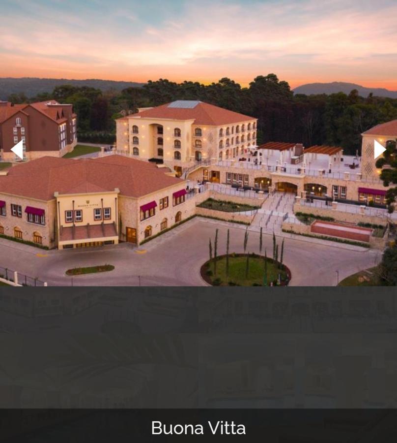 Buona Vitta Gramado Resort & Spa By Gramado Parks Exterior foto The image shows a large, modern building complex, likely a hotel or resort. The architecture features a combination of traditional and contemporary design elements. Surrounding the main building are landscaped areas, including trees and green spaces,
